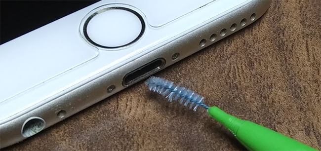 clean iphone charging port to fix it